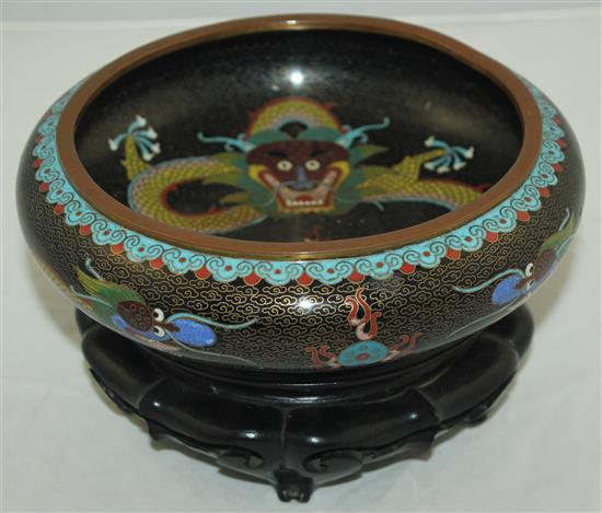 A Chinese cloisonne enamel dragon shallow bowl, Ming mark, early 20th century, diam.20.5cm, ebonised wood stand